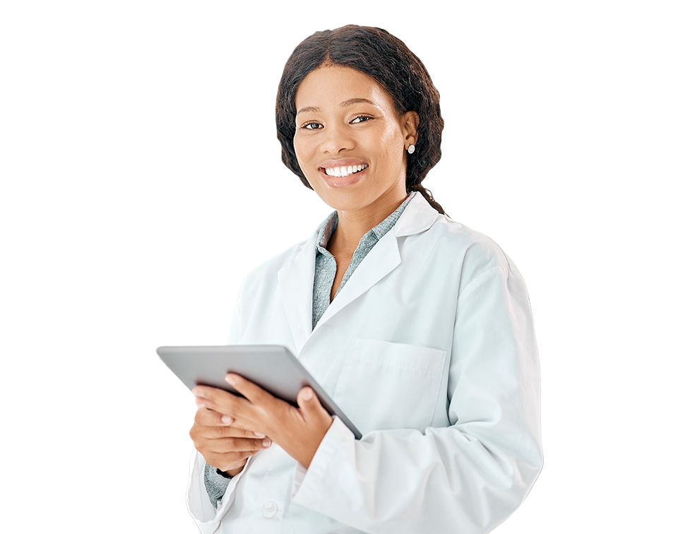 Smiling female doctor in a white coat holding a tablet in a bright clinical setting.